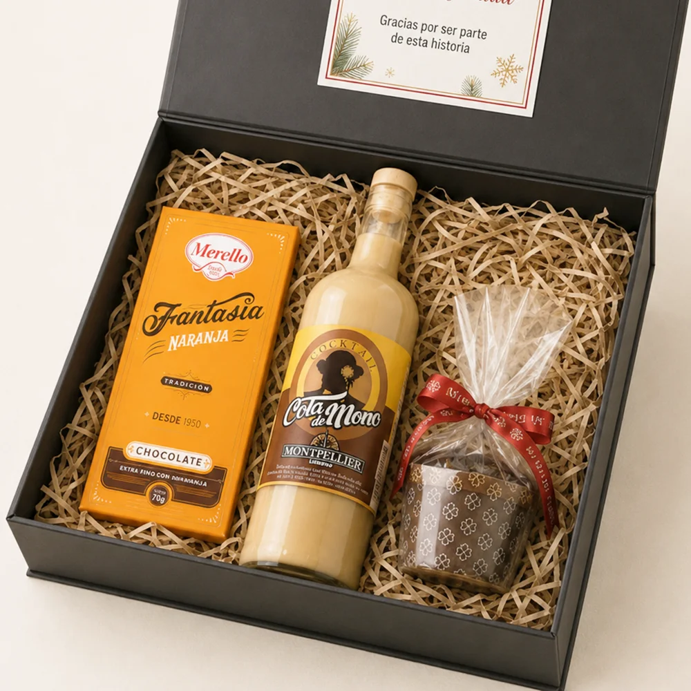 Caja Encanto Navideño con Cola de Mono Montpellier, Mini Pan de Pascua Mi Otra Pasión y chocolates navideños Merello.