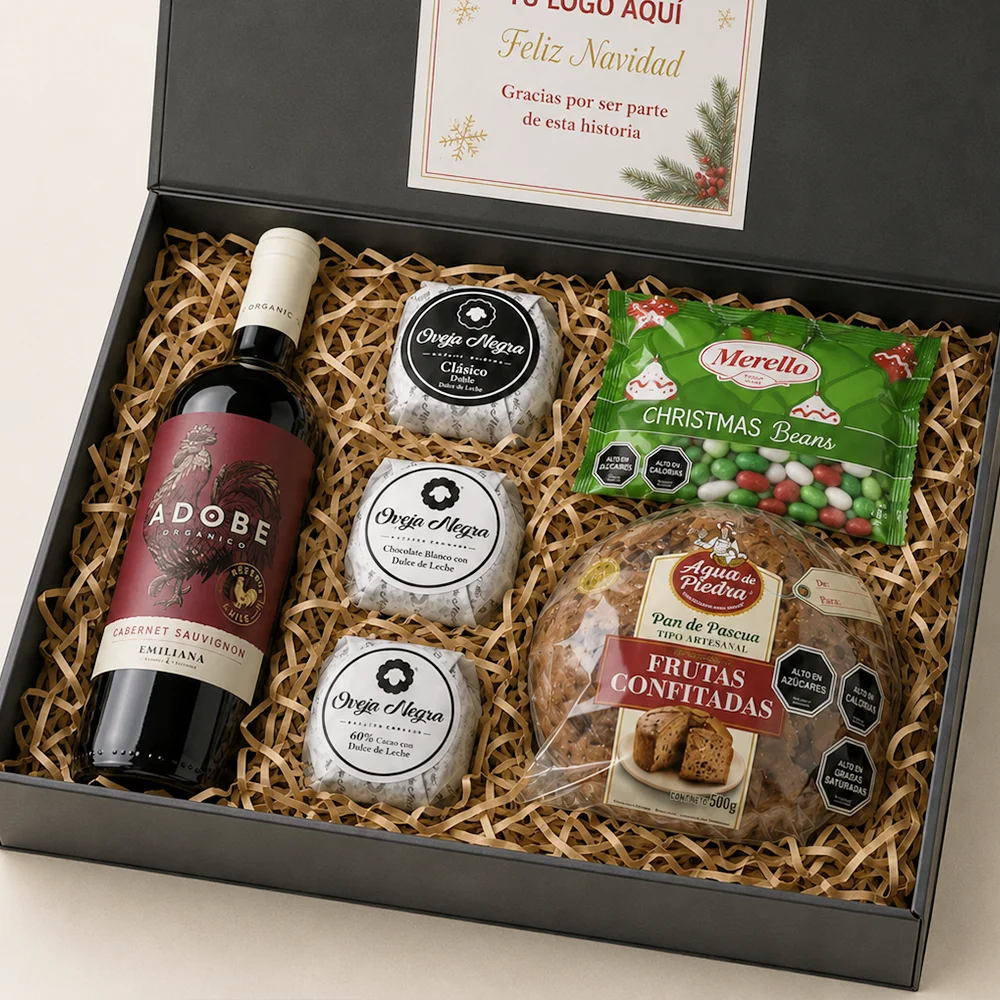 Caja de regalo corporativo Sorpresa Navideña con vino Adobe, Pan de Pascua de 500g, trío de alfajores y porotitos de caramelo.