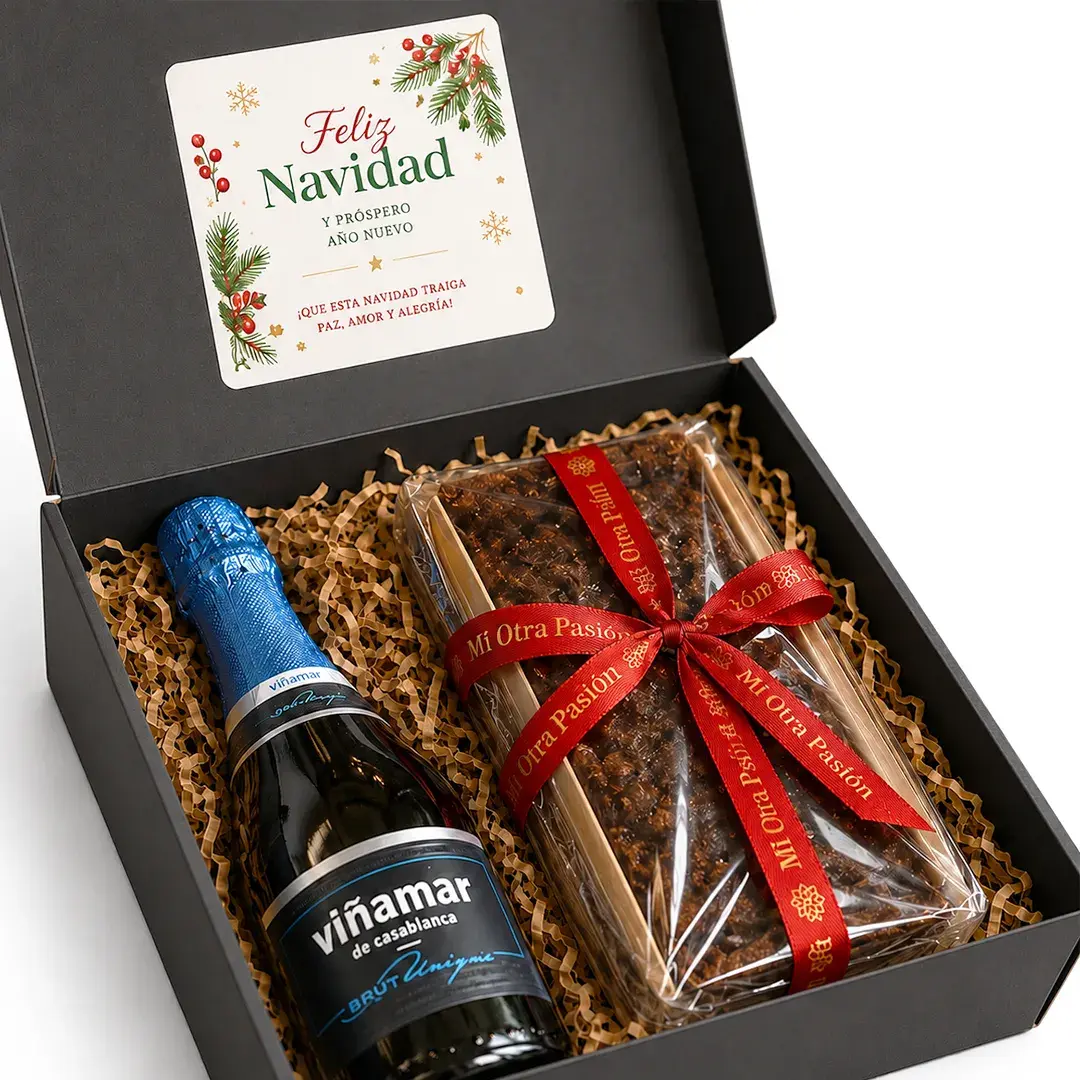 Caja de regalo corporativo Brindis Dulce con Espumante Viñamar y Pan de Pascua artesanal de 800 gramos con lazo rojo.