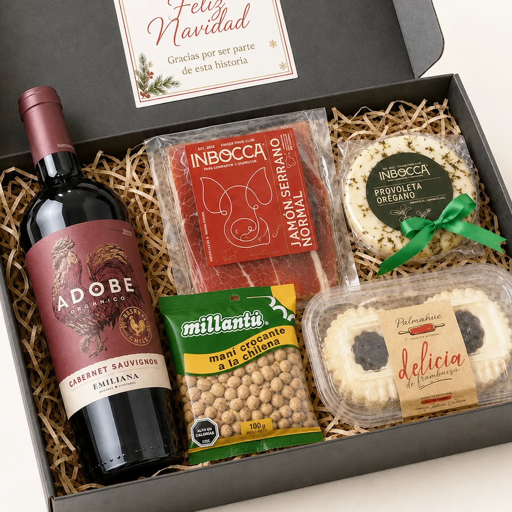 Caja Gourmet Tabla Festiva con vino Adobe, jamón serrano, provoleta, maní con miel y Delicias de Frambuesa Pulmahue.